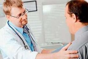 A man with prostatitis during a doctor's appointment
